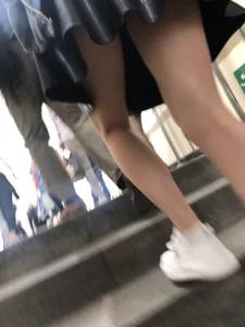 Awesome Candid Girl in a Leather Skirt And Sneakers Walking Down a Street, Then Flashing Her White Panties on the Stairs Creepshots Gallery