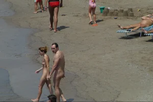 Girls on a nude beach in Sitges, Spain