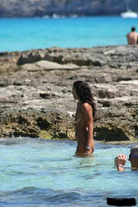 Nude beach ladies in the water showing their tits