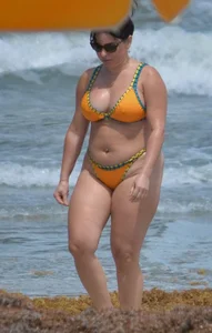 Chubby white girls in bikinis on the beach