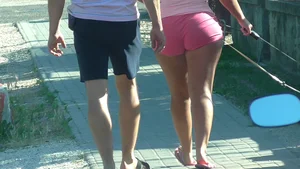 Thick booty babe walking her dogs in pink shorts