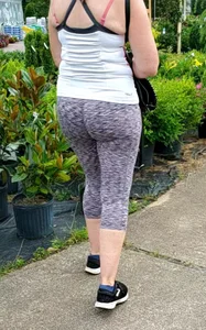 Milf booty in tight leggings shopping for plants