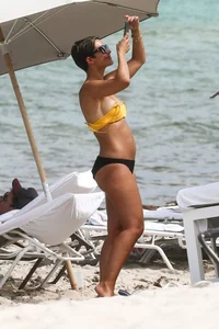 Frankie Bridge nip slips in a bikini on the beach