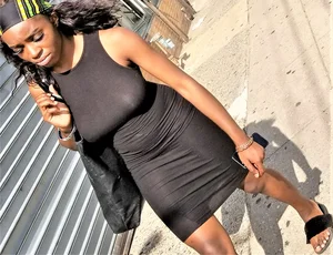 Sexy braless ebony babe in tight skirt with pokies