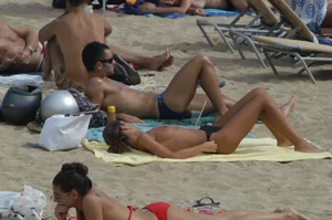 Topless girls on a beach in Barcelona