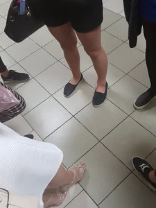 College Girls’ Legs Closeup in a Corridor