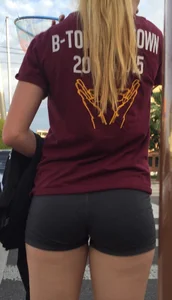 Candid blonde teen's butt in spandex shorts