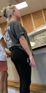 Perky blonde hottie in tight black leggings getting some ice cream