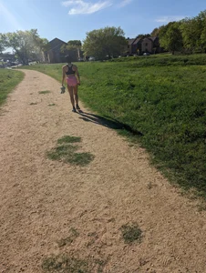 Fit asian chick running in tight pink shorts