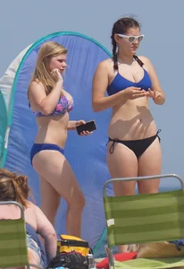 3 girls on the beach in bikinis with big boobs, one brunette and two blondes