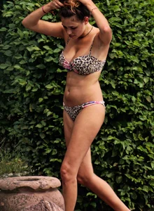 Hot big boobed girl in bikini at the pool