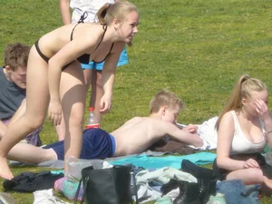 Teen taking off her dress in the park