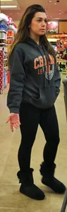 Fit shopping brunette girl in leggings and a hoodie with a nice ass