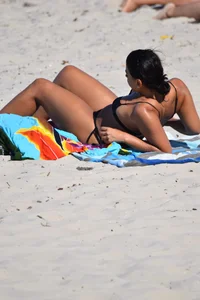 Thick mature brunette bikini lady on the beach with a nice body