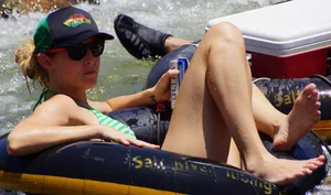 Sexy party girls in bikinis on a lake