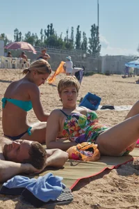 Blonde milf in blue thong bikini