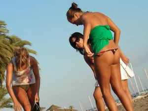Sexy ass girl topless on the beach with a nice ass in a thong bikini