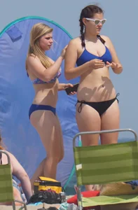 3 girls on the beach in bikinis with big boobs, one brunette and two blondes