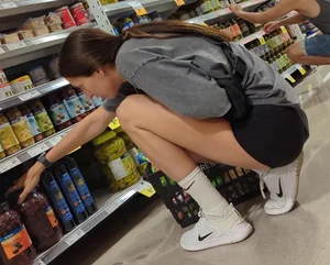 Skinny babe in booty shorts looking for groceries