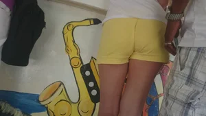 Milf in yellow shorts with vpl and a wedgie