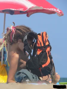Sexy girls going topless at the beach showing off their sexy bodies