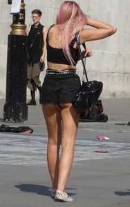 Tall blonde and pink haired girl showing her ass cheeks
