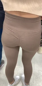 Cutie with round ass in beige leggings at the mall