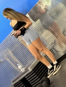 Petite blonde with bubble butt in blue spandex shorts