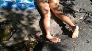 Sexy bikini ass laying out on the rocks up close