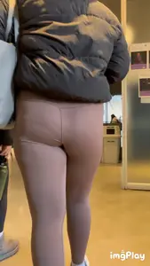 Tall curlyhead college girl in skin coloured leggings