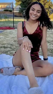 Non-candid girl in a short dress in a park
