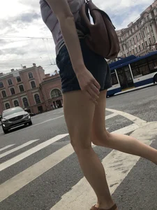 Young Girl in Shorts And Sandals Crossing the Street Gallery