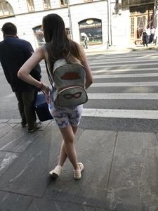 Cute candid girl in tight shorts on a crosswalk