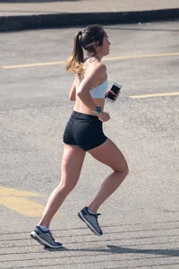 Beautiful girl out for a run in spandex shorts