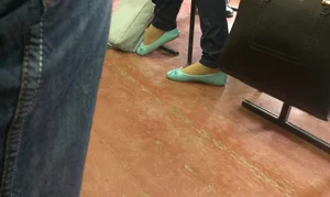 Teen Girl's Feet in Flats Closeup in Class