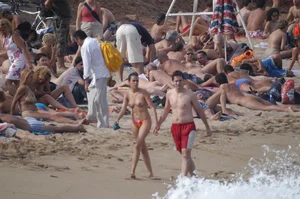 Topless girls on a beach in Barcelona