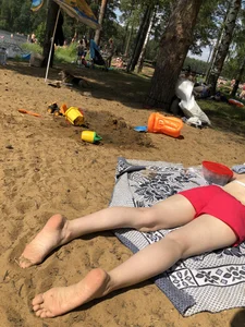 Pale Candid Girl in Shorts and a Bra Lying on the Beach Creepshots