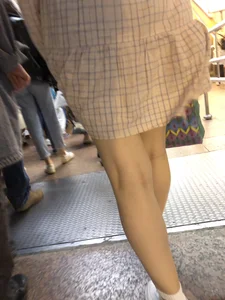 Cute Girl in a Dress with Thin Hot Legs Standing on the Subway Escalator Closeup Creepshots Gallery