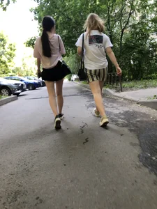 Couple of candid teens walking down the street