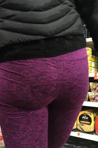 Milf shopping with a nice ass in purple leggings
