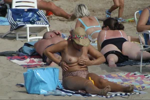 Girls on a nude beach in Sitges, Spain