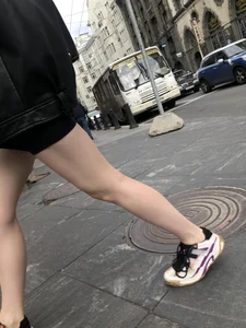 Very hot legs of a candid girl wearing a leather jacket