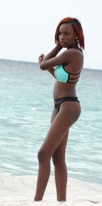 Candid black family, milf and teens on the beach in bikinis