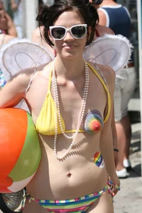 Nude small boobed girl at Toronto pride parade with a couple bonus girls
