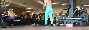 Gym blonde in turquoise leggings notices me and doesn’t mind, even moves in front of me later for some close-ups