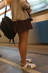 Cute Blonde Teen in a Skirt Subway Legs Closeup