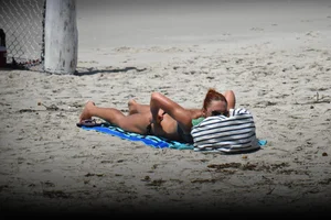 Redhead with nice tits in a bikini on the beach