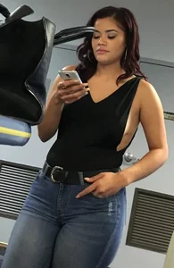 Thick brunette in tight jeans and showing some side boob