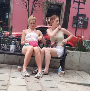 Two pretty blondes, short shorts, nice legs, (laughing)
