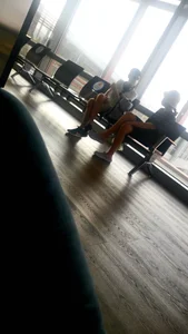 Nice Girls in Dresses Wearing Face Masks Sitting With Crossed Legs